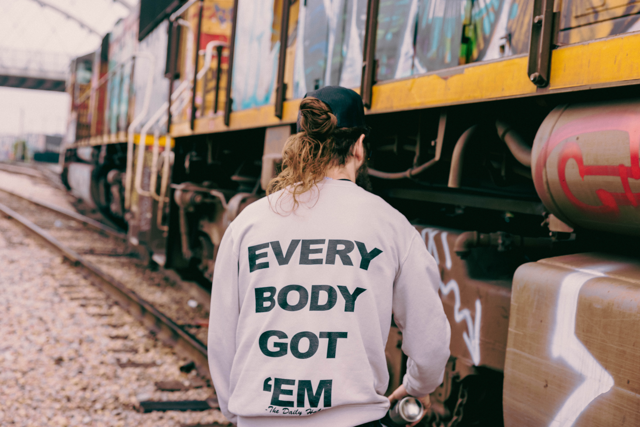 Everybody Got 'Em Motto Crewneck Sweater